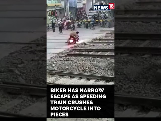 Bike Train Accident News | Biker Escapes Deadly Train Accident | #Shorts | CNN News18 class=