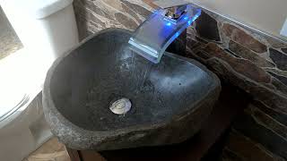 Ultimate MAN CAVE bathroom with unique Stone sink vanity