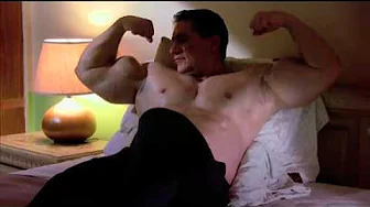 Huge Bodybuilder Big George flexing in bed