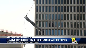 High-rise crane removes scaffolding from BGE building