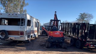 Demolishing a rv with an excavator