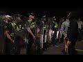 Riot police clash with protesters in Portsmouth after 140 migrants rescued from 'mega-dinghy'
