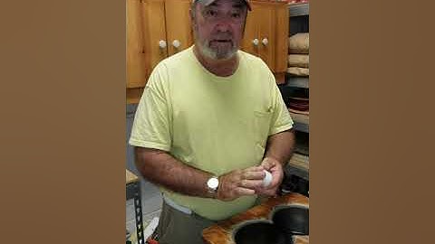 Waxing shuffleboard discs.