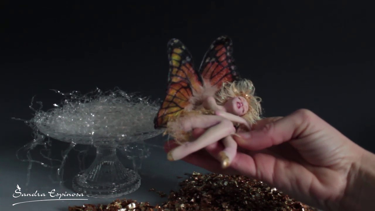 Golden tinkerbell sleeping sculpture handmade by SEM