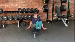 Traveling leg raise over dumbbell ...