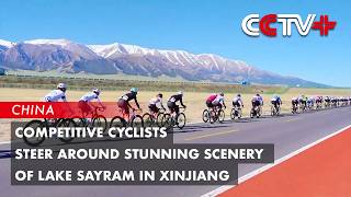 Competitive Cyclists Steer Around Stunning Scenery of Lake Sayram in Xinjiang
