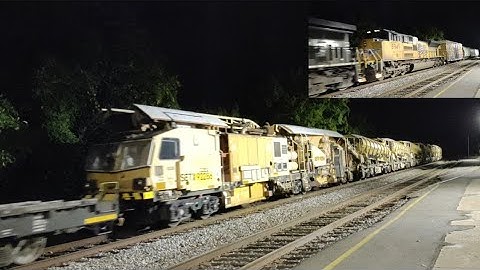 NS 13R with a british ballast cleaner and UP 8949 trailing in Charlottesville, VA