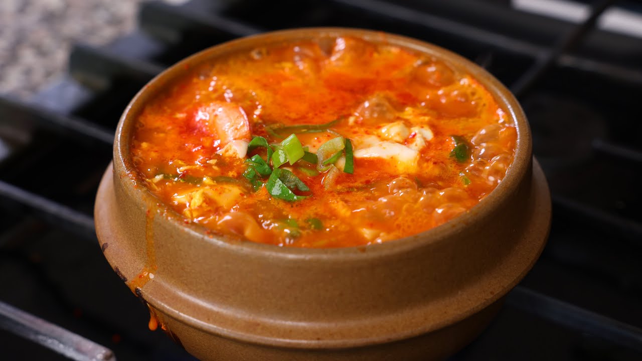 Korean spicy soft tofu stew with seafood (Haemul sundubu-jjigae:  )