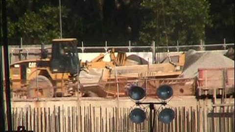 Caterpillar 966G wheel loader loading a 40 yard ADT bed