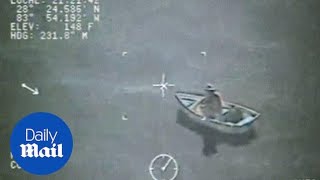 US Coast Guard rescues man and dog after boat catches fire - Daily Mail