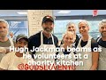 Hugh Jackman beams as he volunteers at a charity kitchen