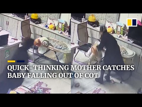 Quick-thinking mother in China catches baby falling out of cot