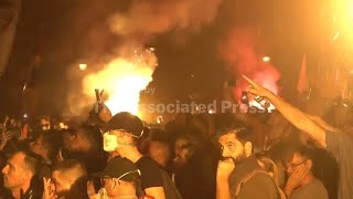 Tear gas is fired in Serbia at thousands of protesters demanding free elections and justice