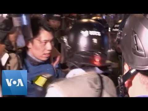 hong-kong-police-charge-against-protesters,-detain-one