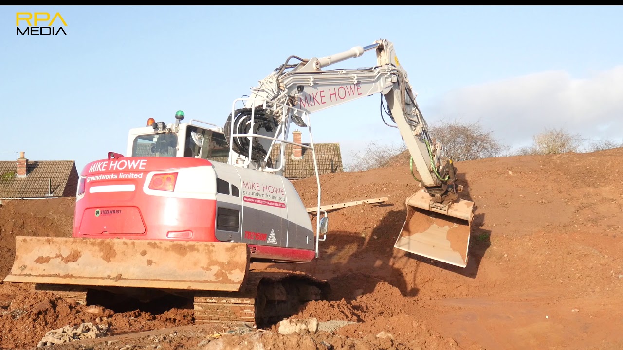 Takeuchi TB2150 with Steelwrist tilt rotator