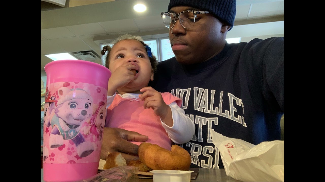 man and child eating in GVSU dining hall