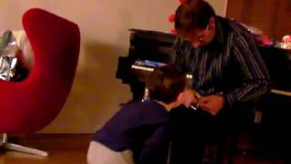 Grayson Danger opens presents with Grandpa Christmas 2009