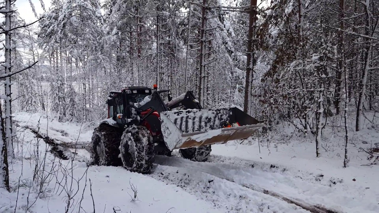 Valtra a93 almost stuck in snow and mud with heavy timber load