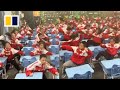 Students perform battle dance during chinese lesson