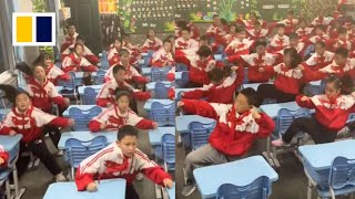 Students perform ‘battle dance’ during Chinese lesson
