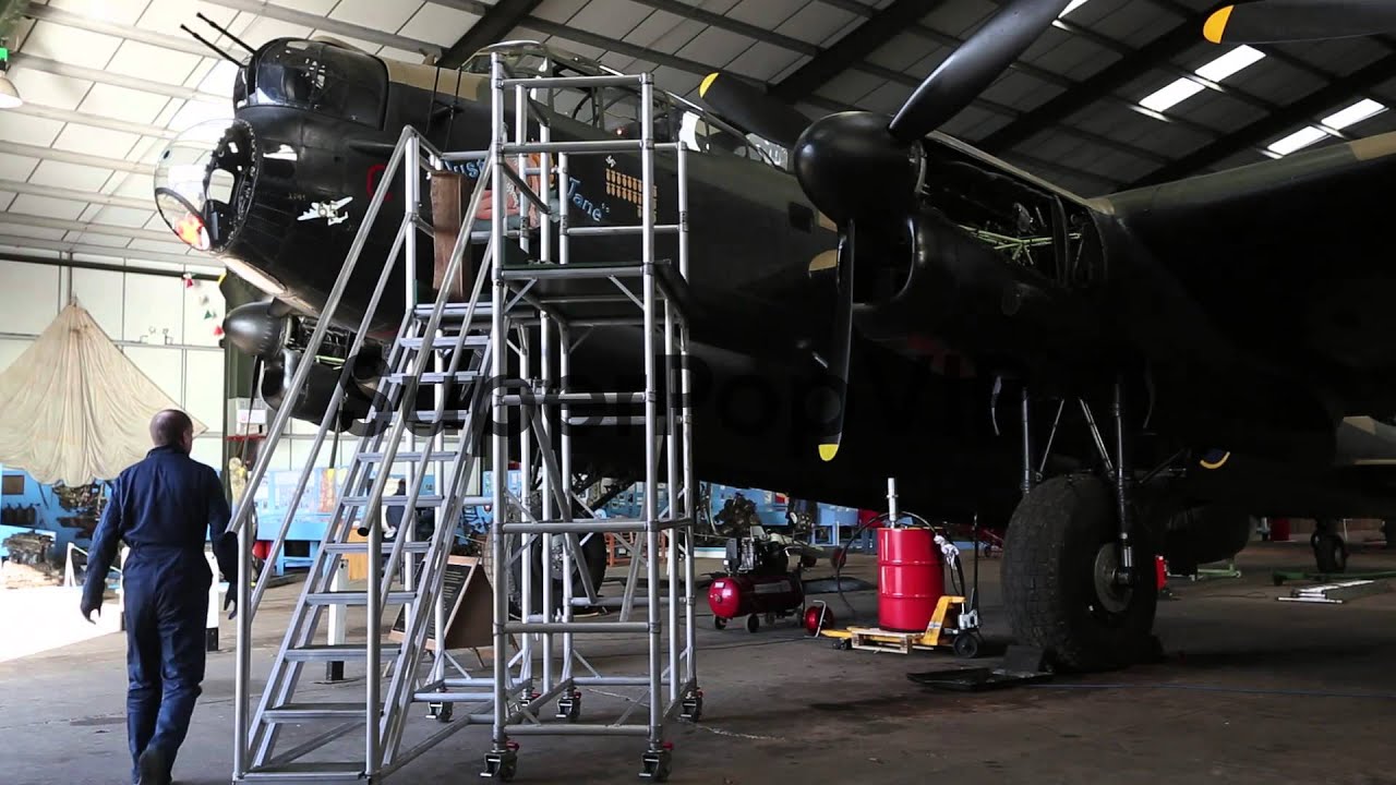 Engineer Keith Breachley works on the Lancaster bomber 'J...