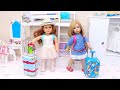 Sister dolls packing new travel suitcases with clothes for vacation trip I Play Toys
