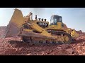 The biggest bulldozer in the world komatsu d575 working in the mountains