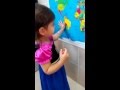 Sofi locating countries on world map (2 years 6 months old)