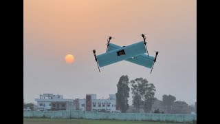 Swiveling biplane-quadrotor forward flight