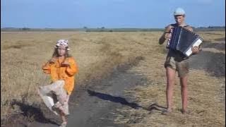 На баяне\Russian Kid playing the accordion while his sister is lost in dance, Accordion Harmonica