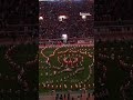 Pride of the Southland Band performs light up Circle Drill for dark mode game