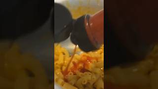 Putting Hot Sauce On Mac & Cheese