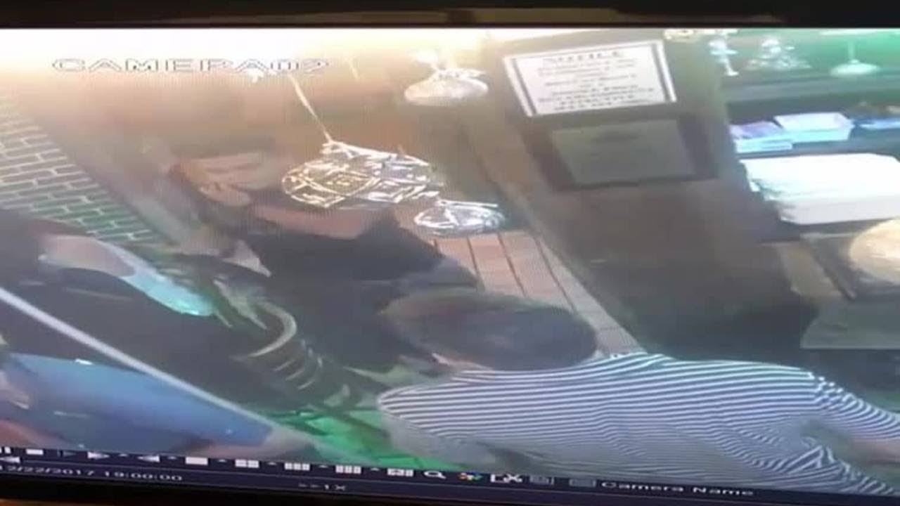 Men caught on camera stealing purse from back of woman's chair - YouTube