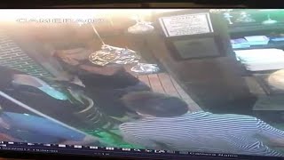 Men caught on camera stealing purse from back of woman's chair
