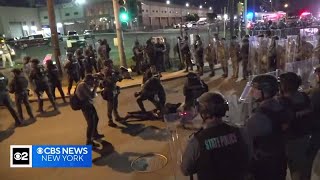 Protesters and police at Delaney Hall immigration detention center in Newark on the first night of t