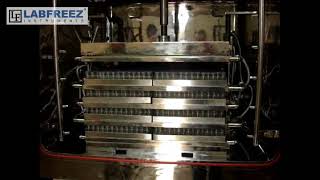 Download Lagu Loading vials in freeze dryer and stoppering caps MP3