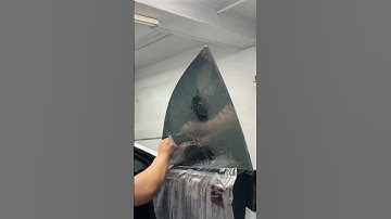 Tinting a window with the worlds smallest squeegee!