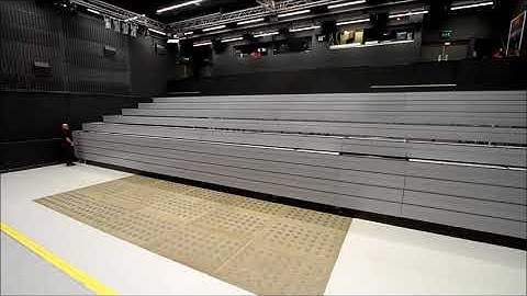 Fixed, recessed retractable seating system with lecture theatre chairs