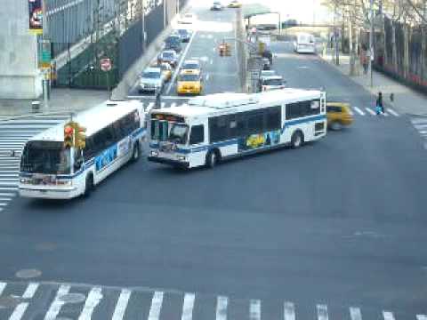 Here we are in Tudor City, above 42nd Street between 1st and 2nd Avenue. In the span of 4 minutes and 45 seconds, we see 12 TA buses. I am not going to list every bus I saw but here is a short rundown. I saw an Orion VII next generation bus, along with some New Flyer Artics on the M104, some RTS's on the M42 and M5, an MCI on the X17J, and a few other buses, whose routes I am unsure of. In the distant background, we see Queens, as well as U Thant Island (also known as Belmont Island, which is the small rock outcropping with a warning light for ships) just off of the Manhattan shore in the East River. We also see the UN building. Enjoy the view of all the buses and the other bits of scenery. Happy St. Patrick's Day. If you have any questions about the video, feel free to message me. Comments are welcome. The video was taken on March 17th, 2009.