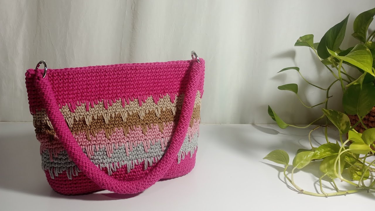 Bolsa de crochê feita com barbante trabalhada  nesse lindo ponto passo a passo