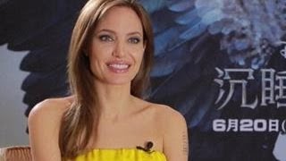 Angelina Jolie Opens Up About Brad Pitt's Red Carpet Run-In With Prankster