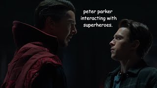 peter parker interacting with superheroes.