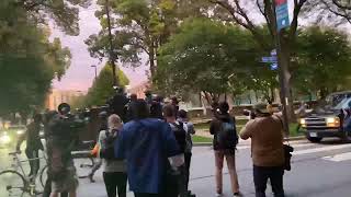 Armed officer at Cleveland presidential debate demonstration flips off Black Lives Matter protesters