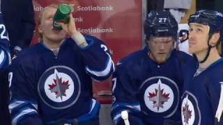 Brent Burns tries to hit Laine, but hits his own man