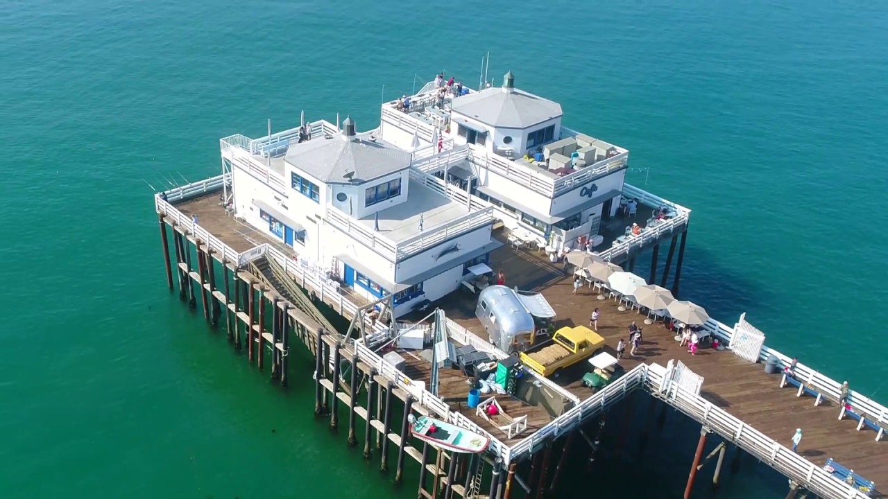 ⁣Los Angeles via Drone - Malibu Pier and Surfers