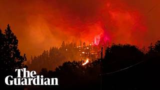 Fast-moving wildfire engulfs hills in western Canada