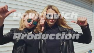 Video thumbnail of "Two stylish young girls in leather jackets and sunglasses on a white background show a gesture"