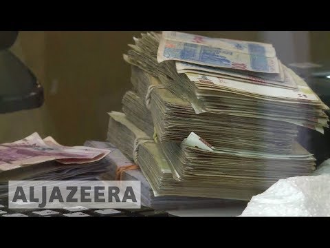 ?? Iran arrests currency traders as rial plummets