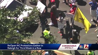 ReOpenNC protesters march through Raleigh rallying against stay-at-home order as legislators retu...