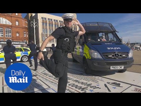 Police officers break out in DANCE outside Blackpool's promenade - Daily Mail